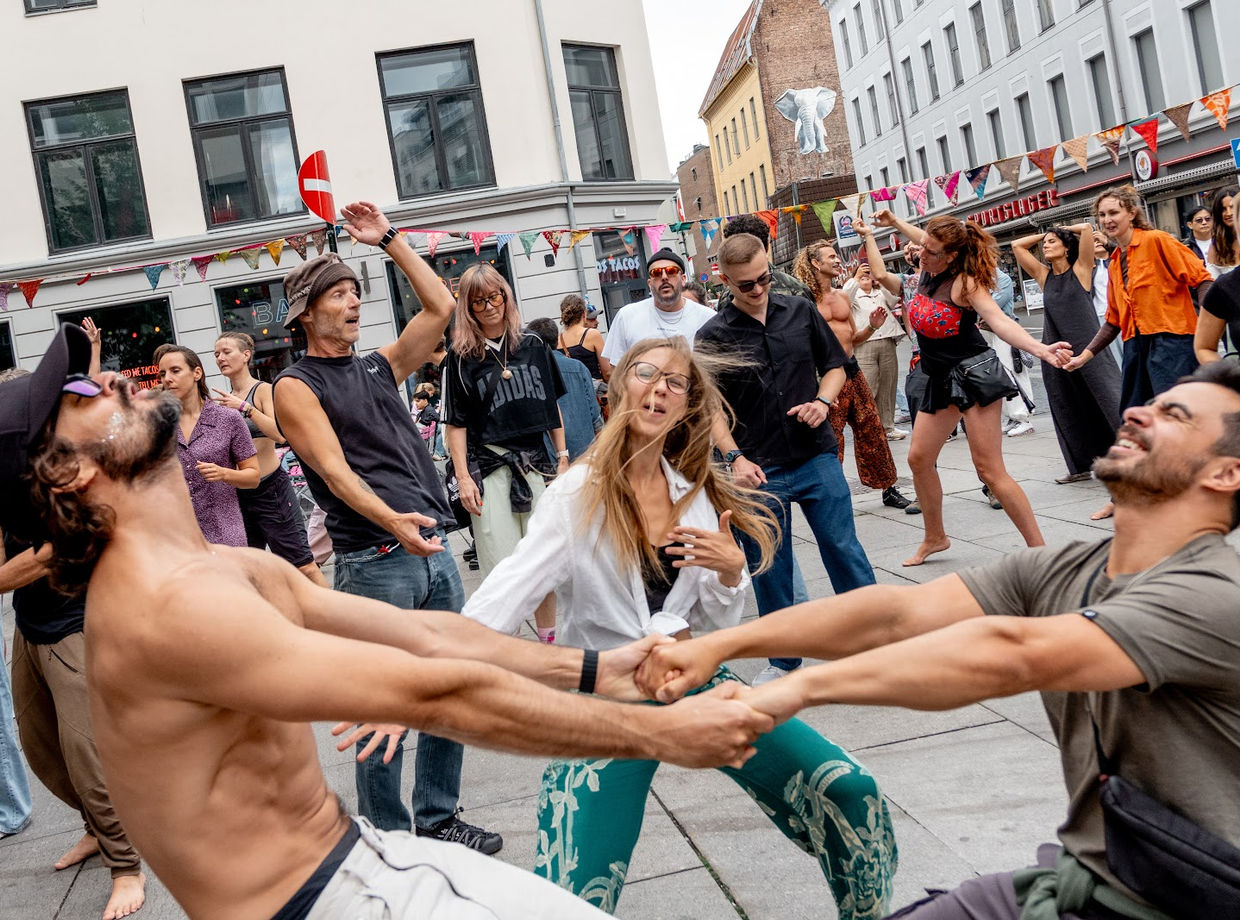 Two dancers swinging each other round