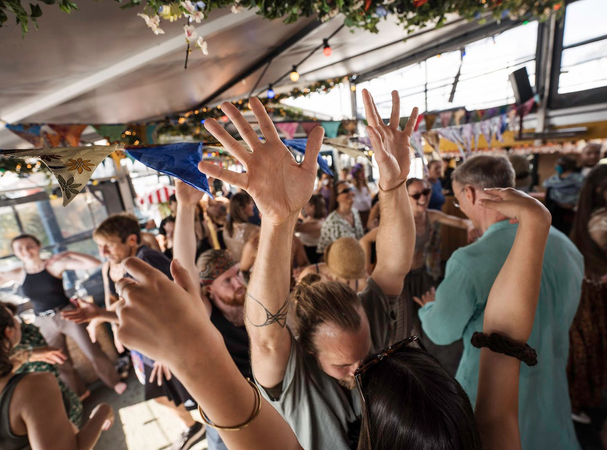 Arms up on the boat
