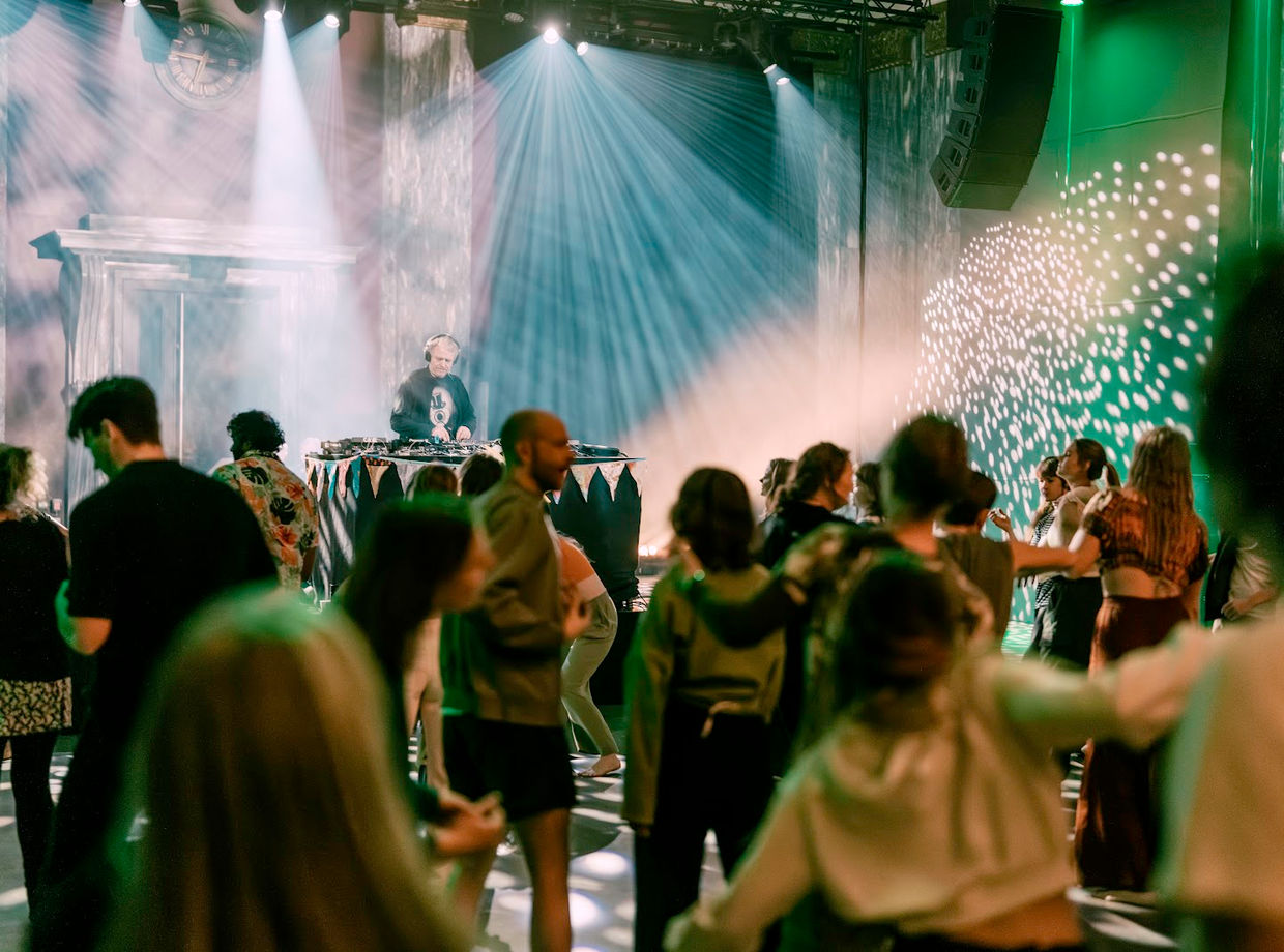 Dancers in the haze and light beams
