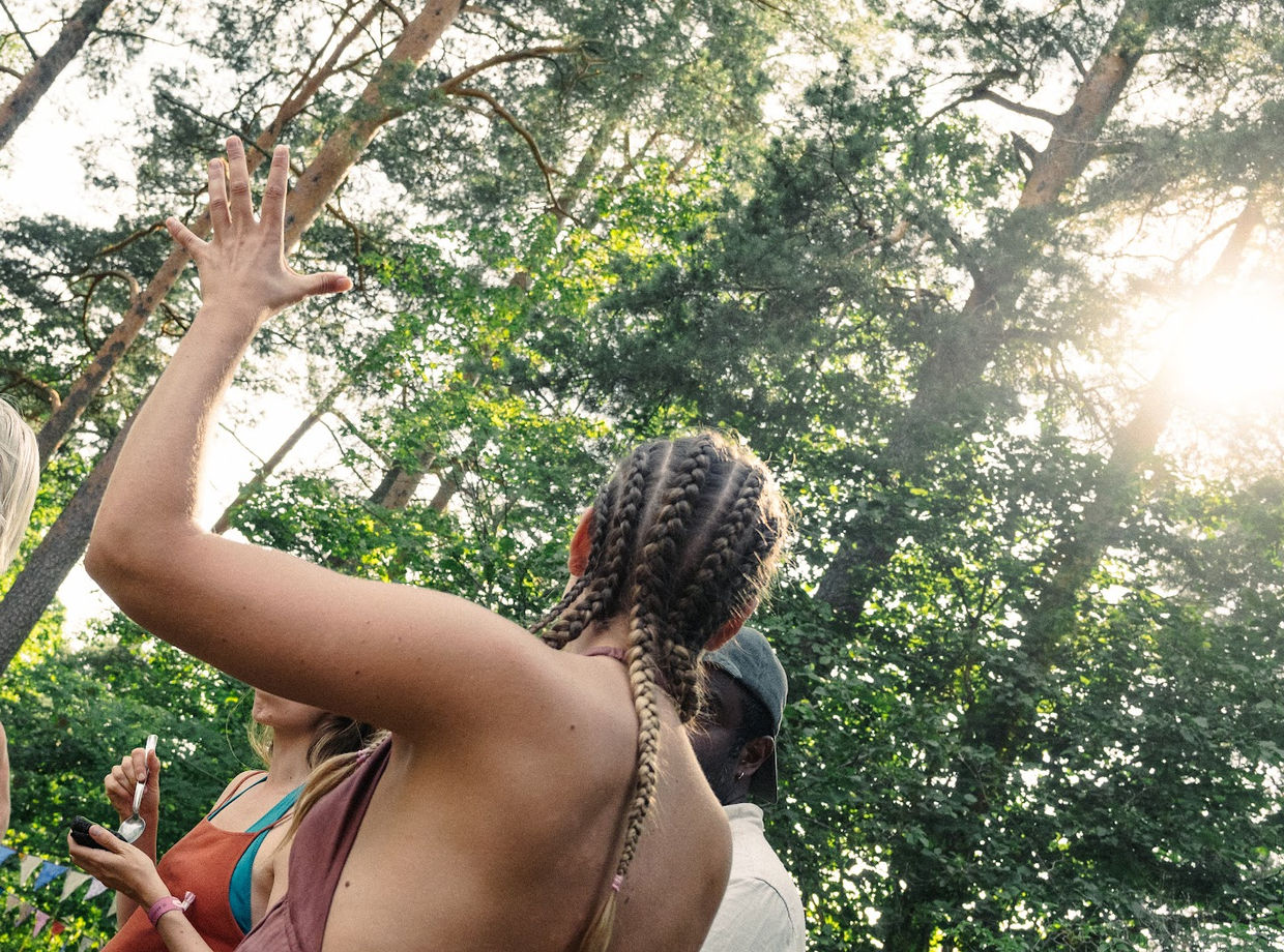 Arms up in the low sun