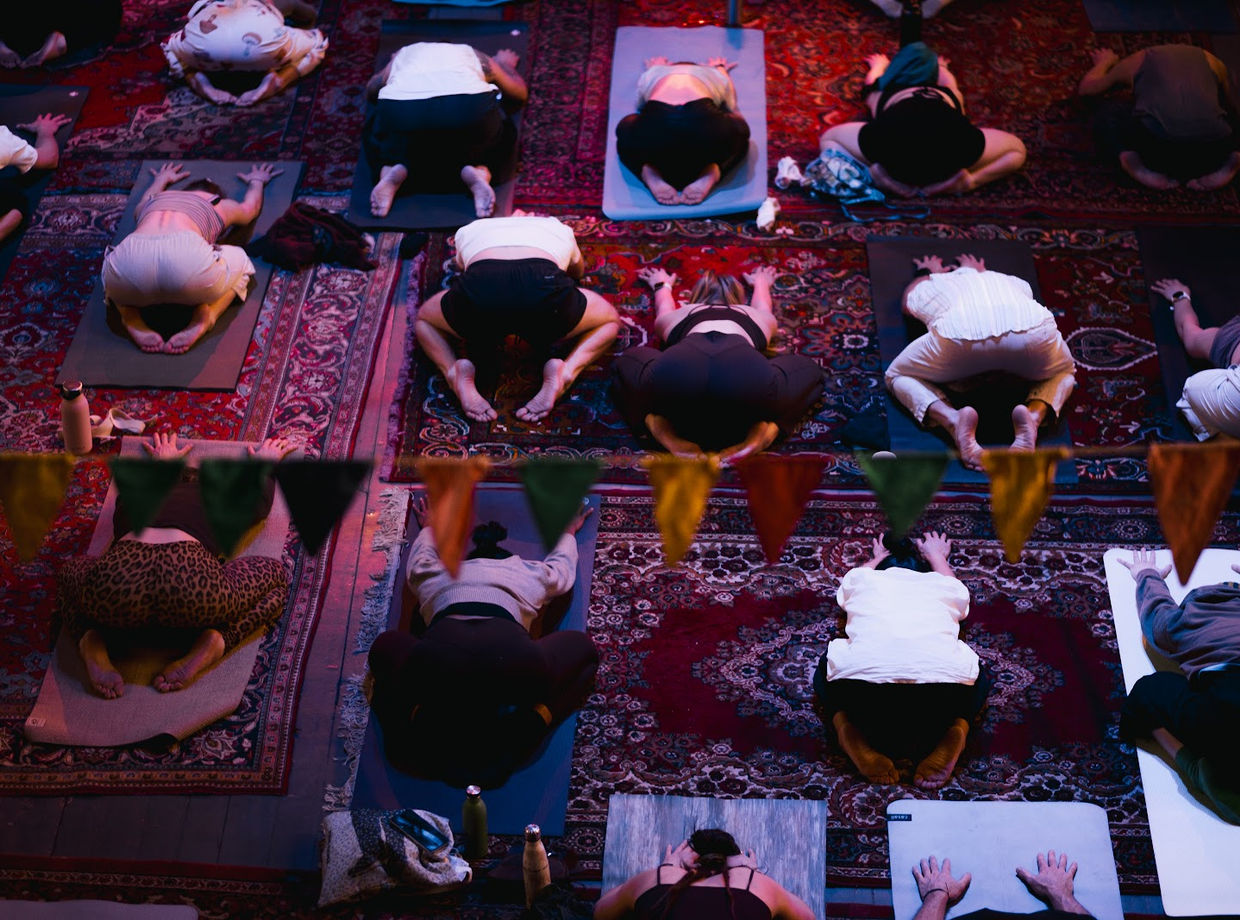 Yoga on oriental rugs, seen from above