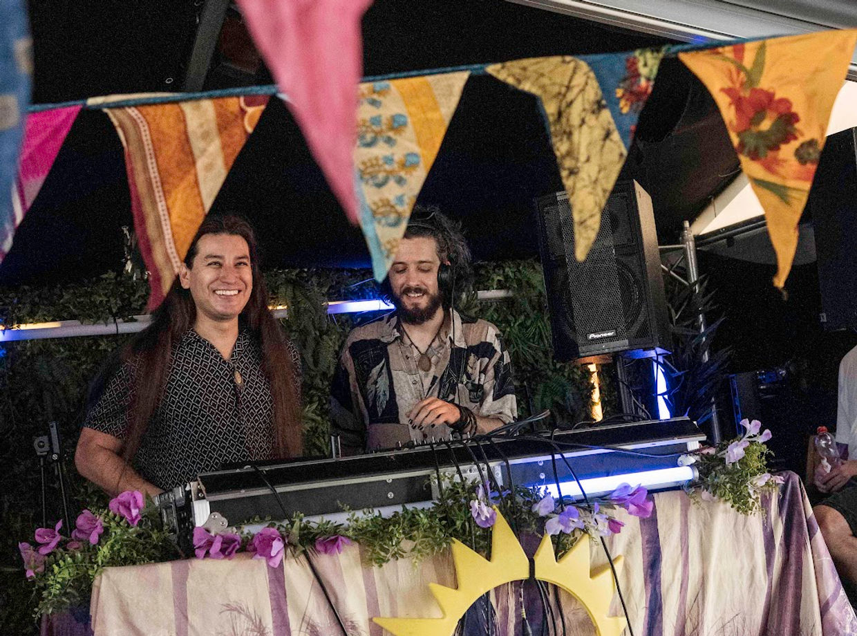 The DJ behind a sunflower on the boat
