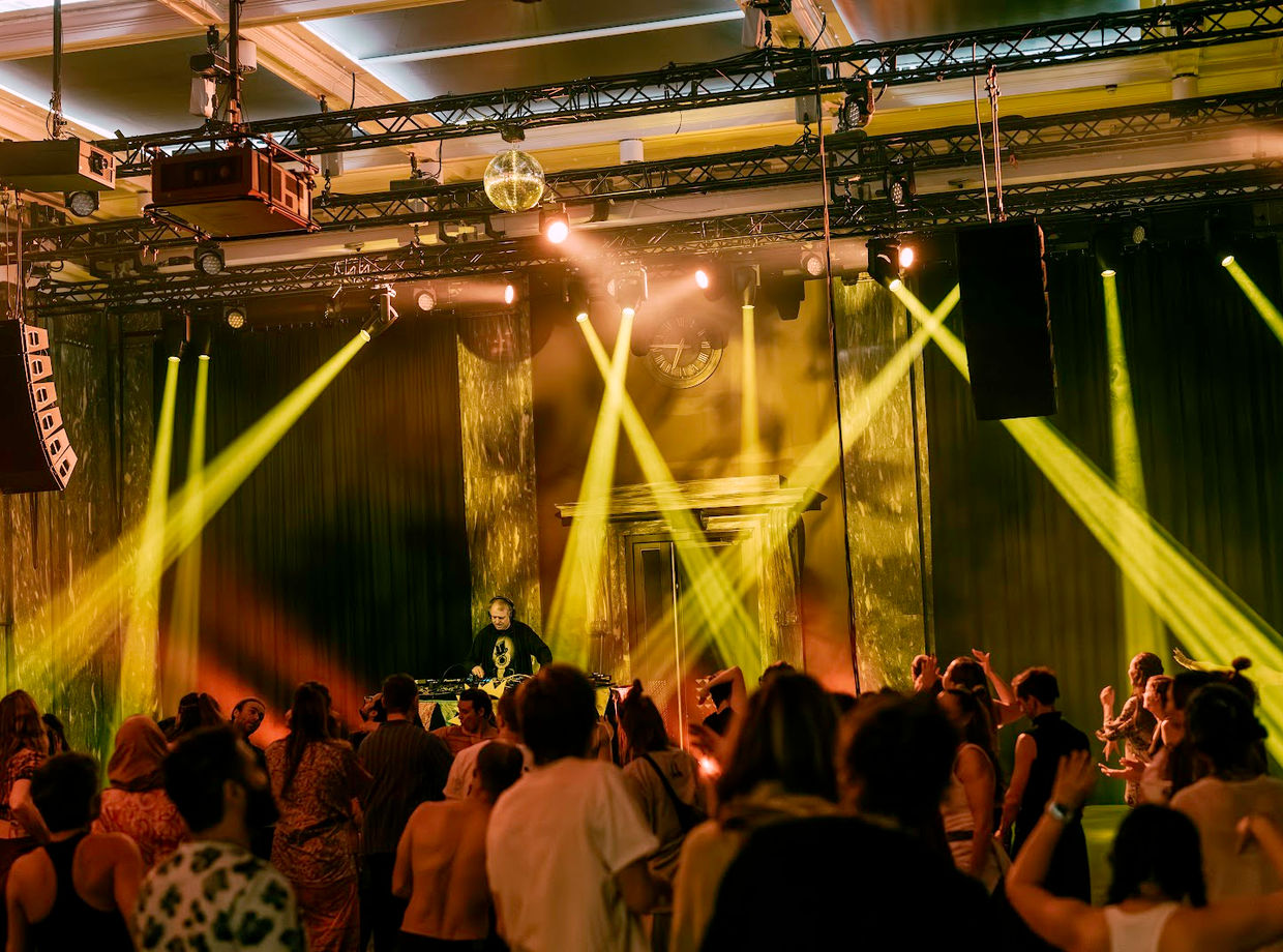 Yellow light beams over the crowd