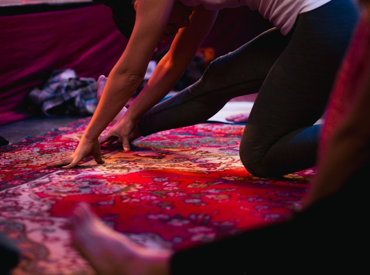 A yoga stretch on a rug
