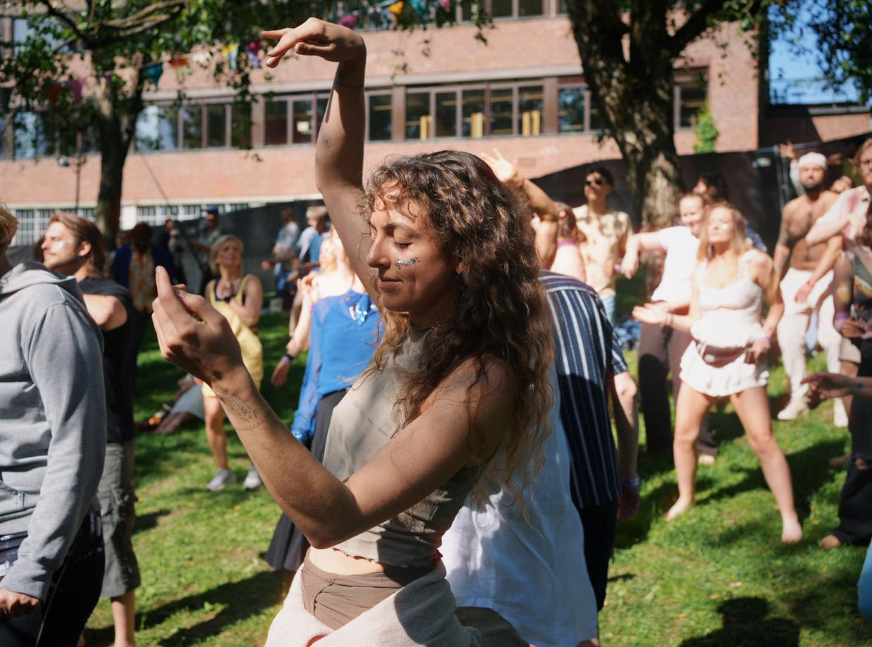 A dancer smiling mid-move