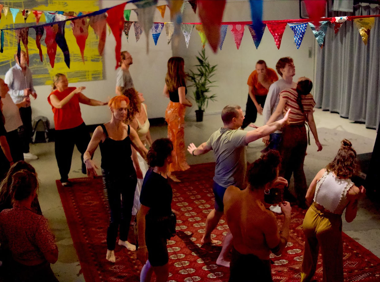 The dance floor seen from above, arms out and moving