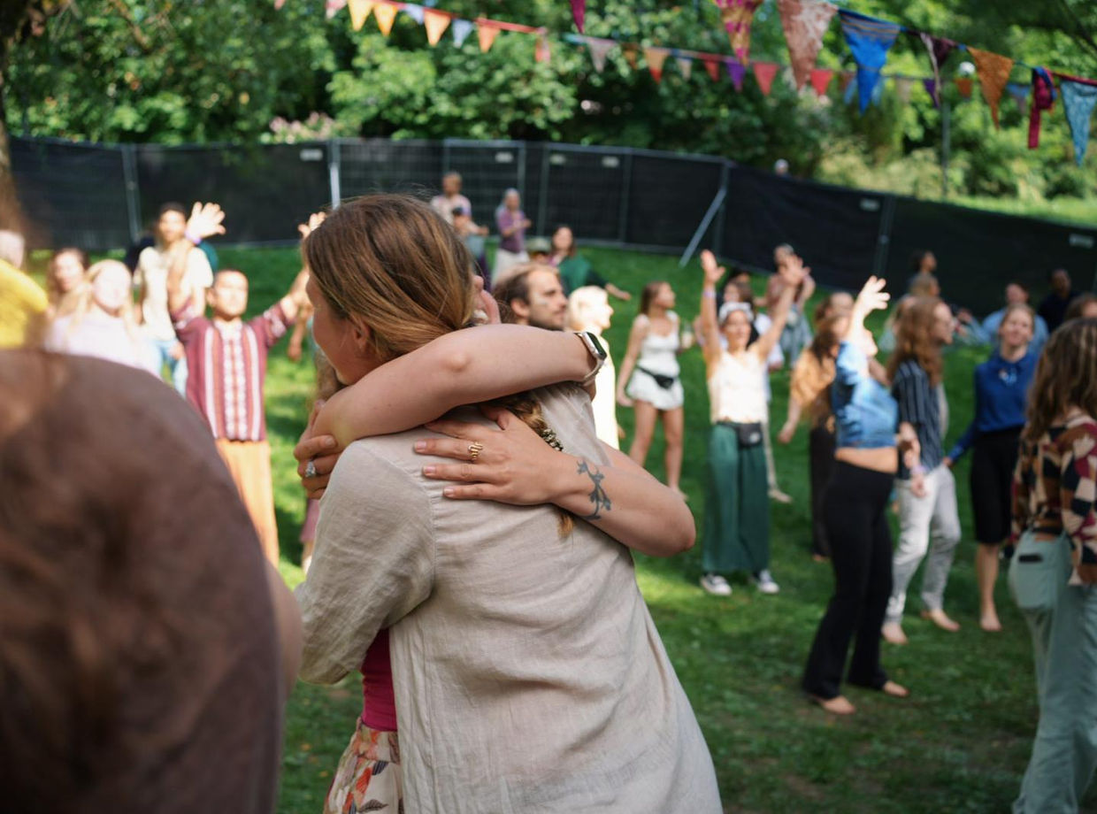 A warm hug among the dancers